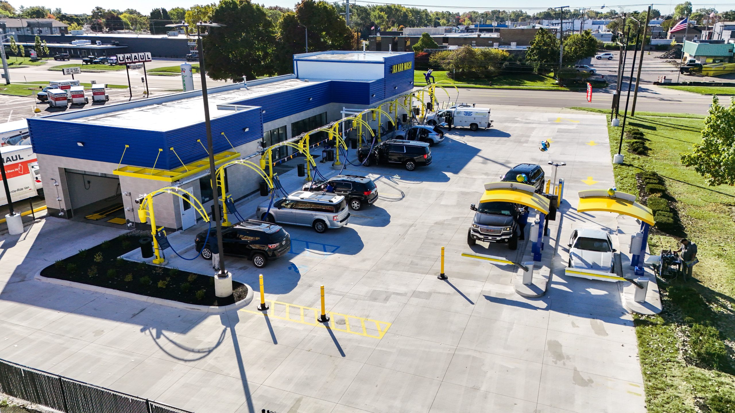 A busy Jax Kar Wash location on a clear Michigan day